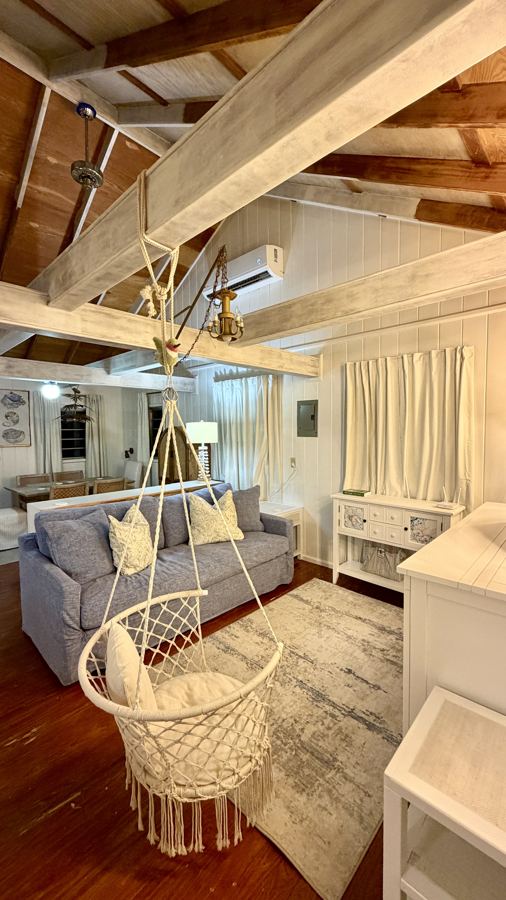 Bedroom beneath wooden beams
